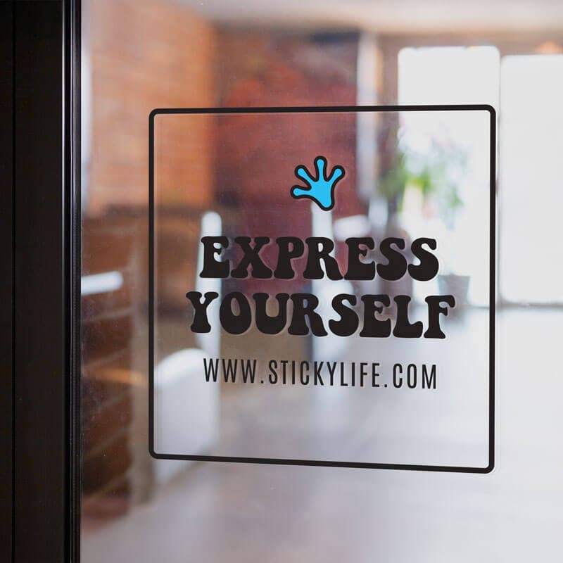 A square "Express Yourself" sticker with a border and branding, applied to a glass storefront.